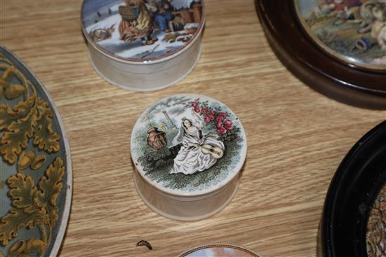 A group of Prattware plates, a mug and pot lids